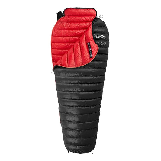 An image of black Nylon, goose down weather resistant sleeping bag with a red lining, with white backdrop